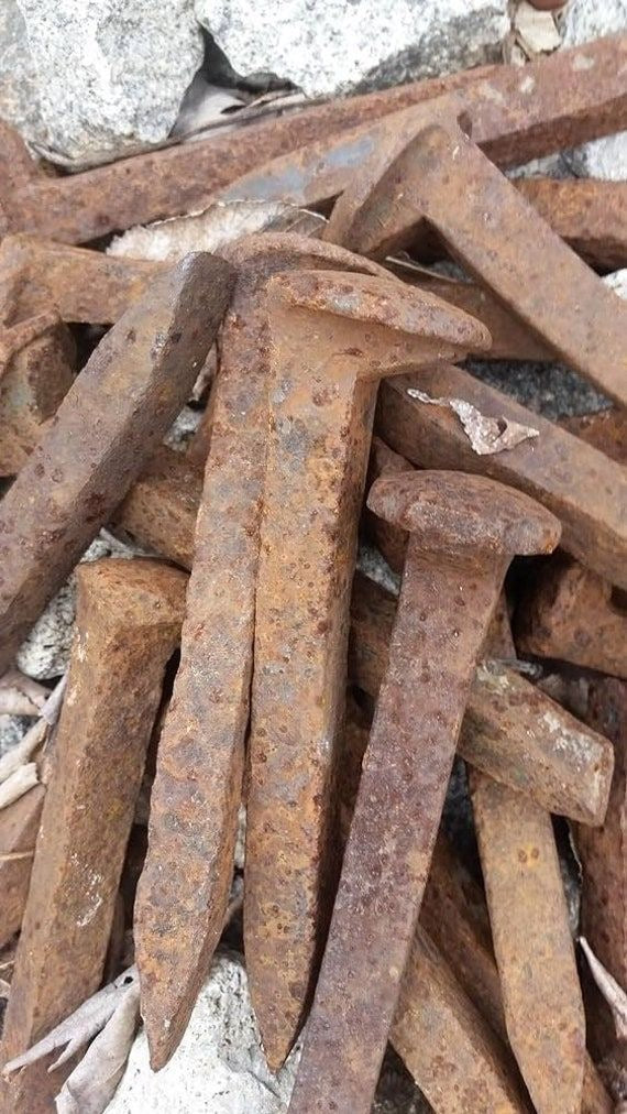 Railroad Spikes Dusted in Red Brick Dust.